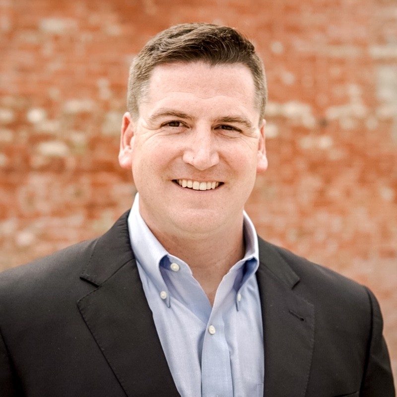 Professional headshot of Hayes Carter.