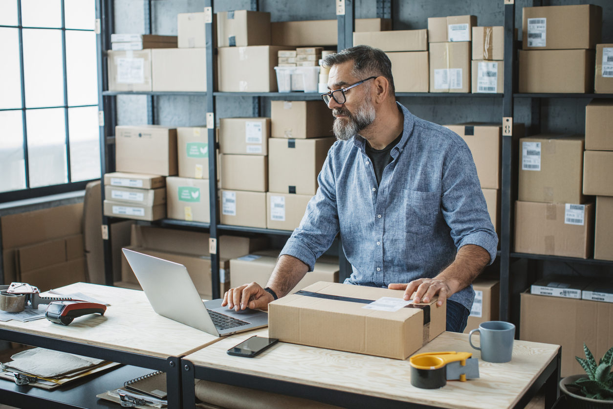 Small business owner fulfills a shipment in his factory.