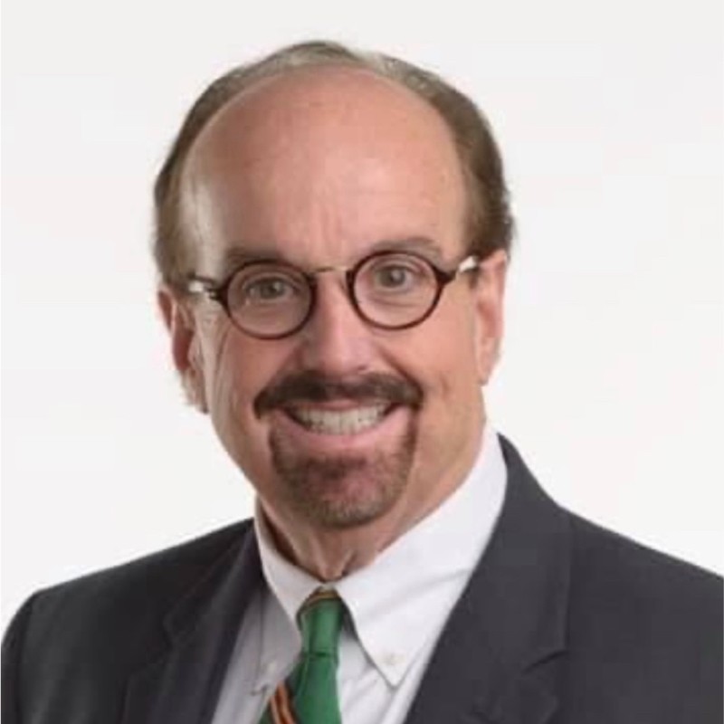 Professional headshot of Mark Thomas.