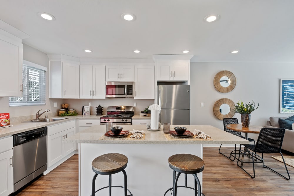 Kitchen with white cabinets and stainless steel appliances