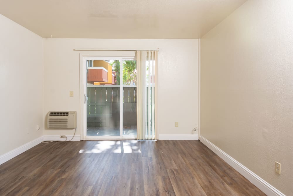 Unfurnished Living area with view of sliding doors to patio