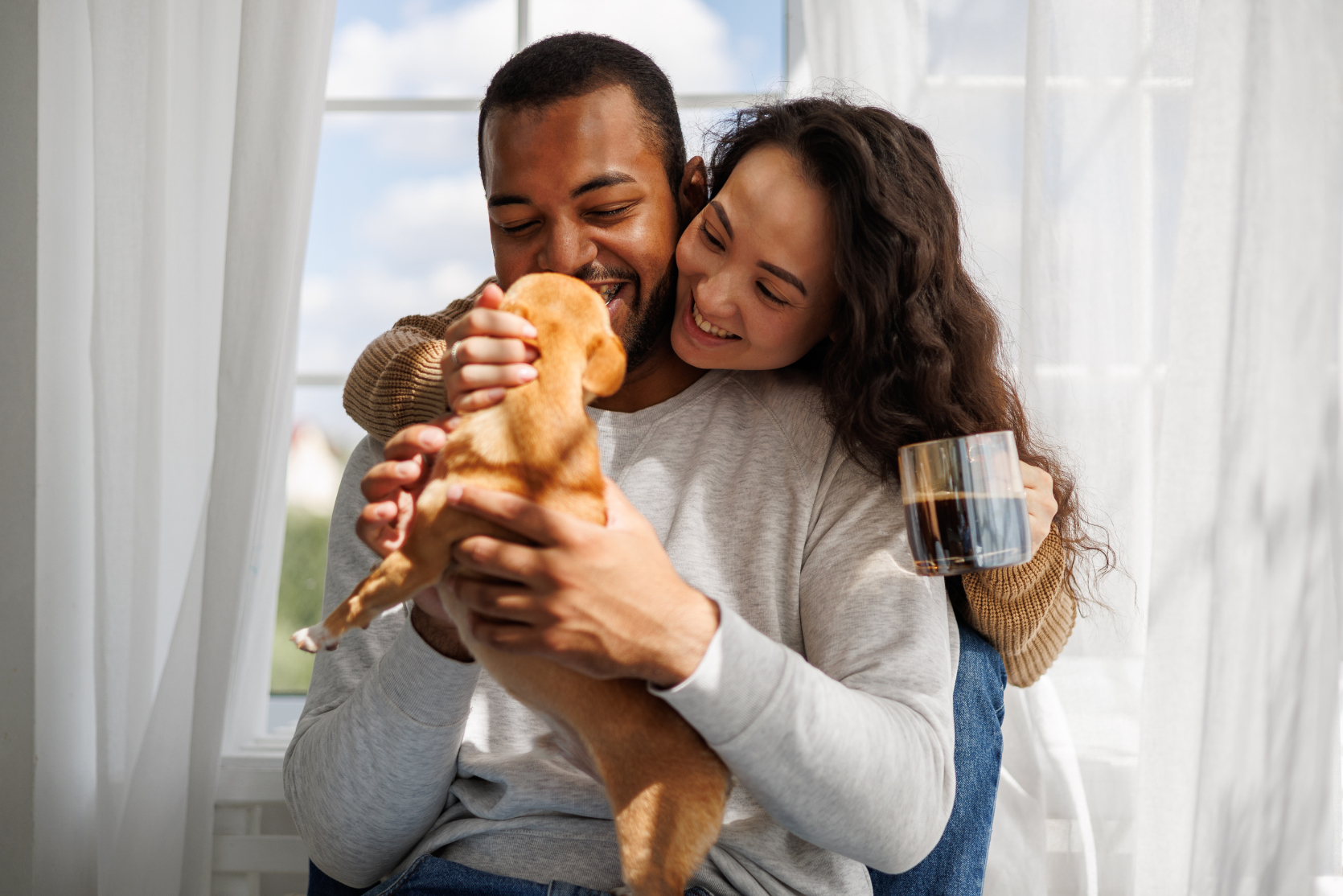 Woman and man with puppy stock image