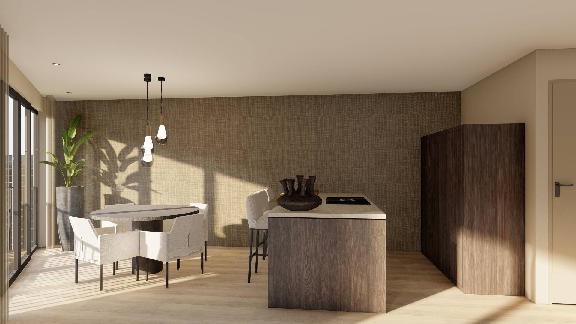 Modern dining area with round wooden table, white upholstered chairs, kitchen island with cooktop, and tall plant by glass doors.
