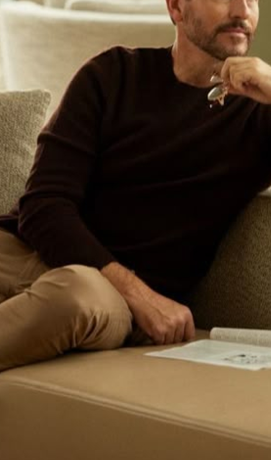 Therapist sitting attentively across from a patient during a mental health session