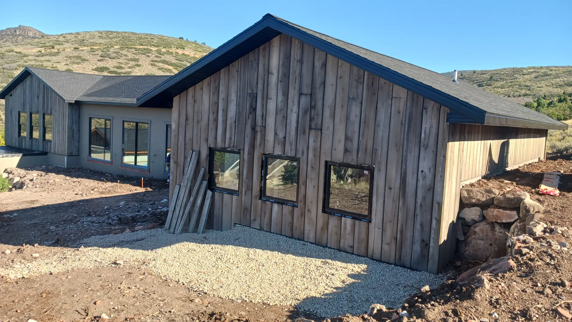 House with stucco and wood-paneled exterior.
