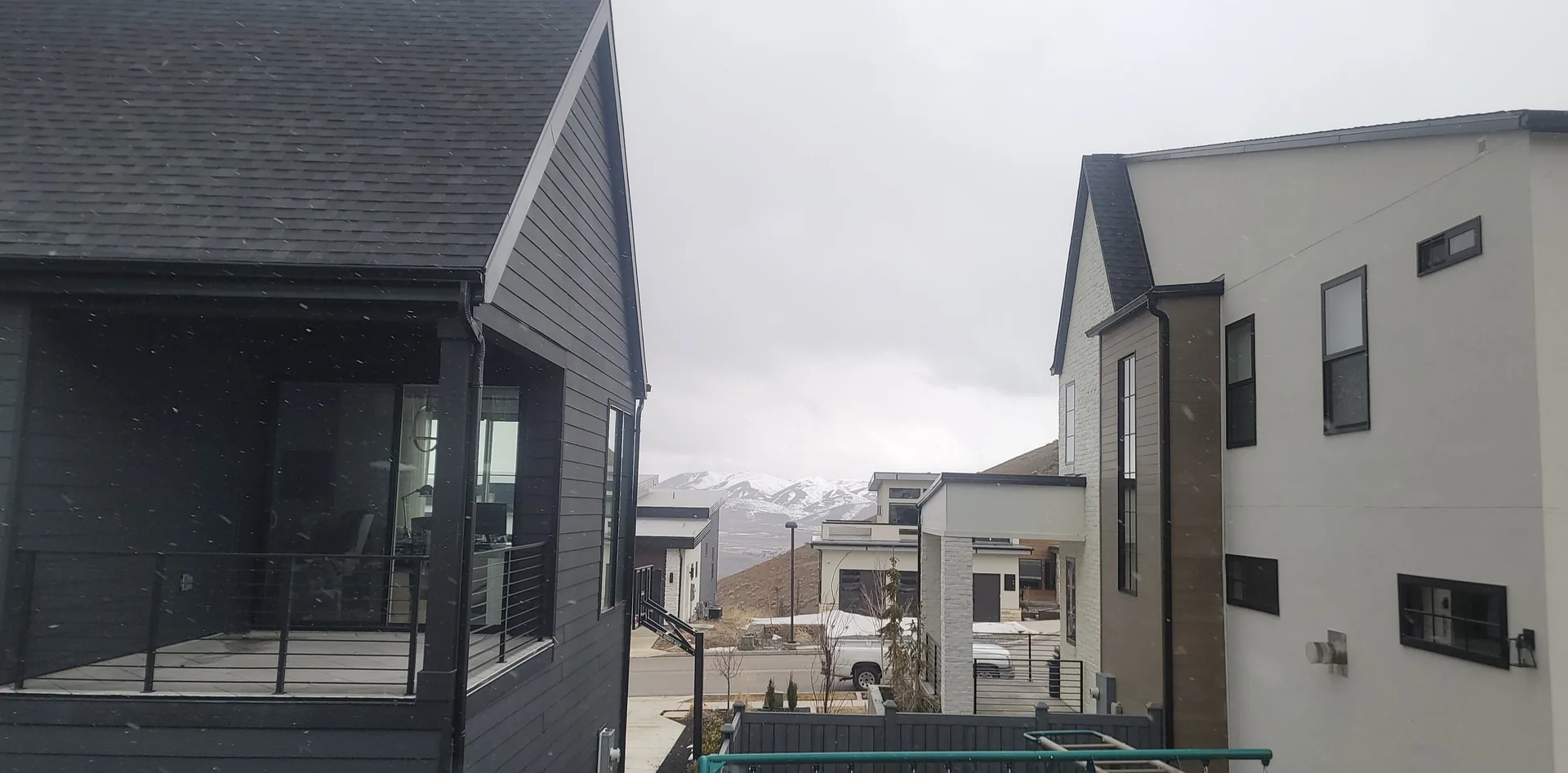 View between modern houses at job site.