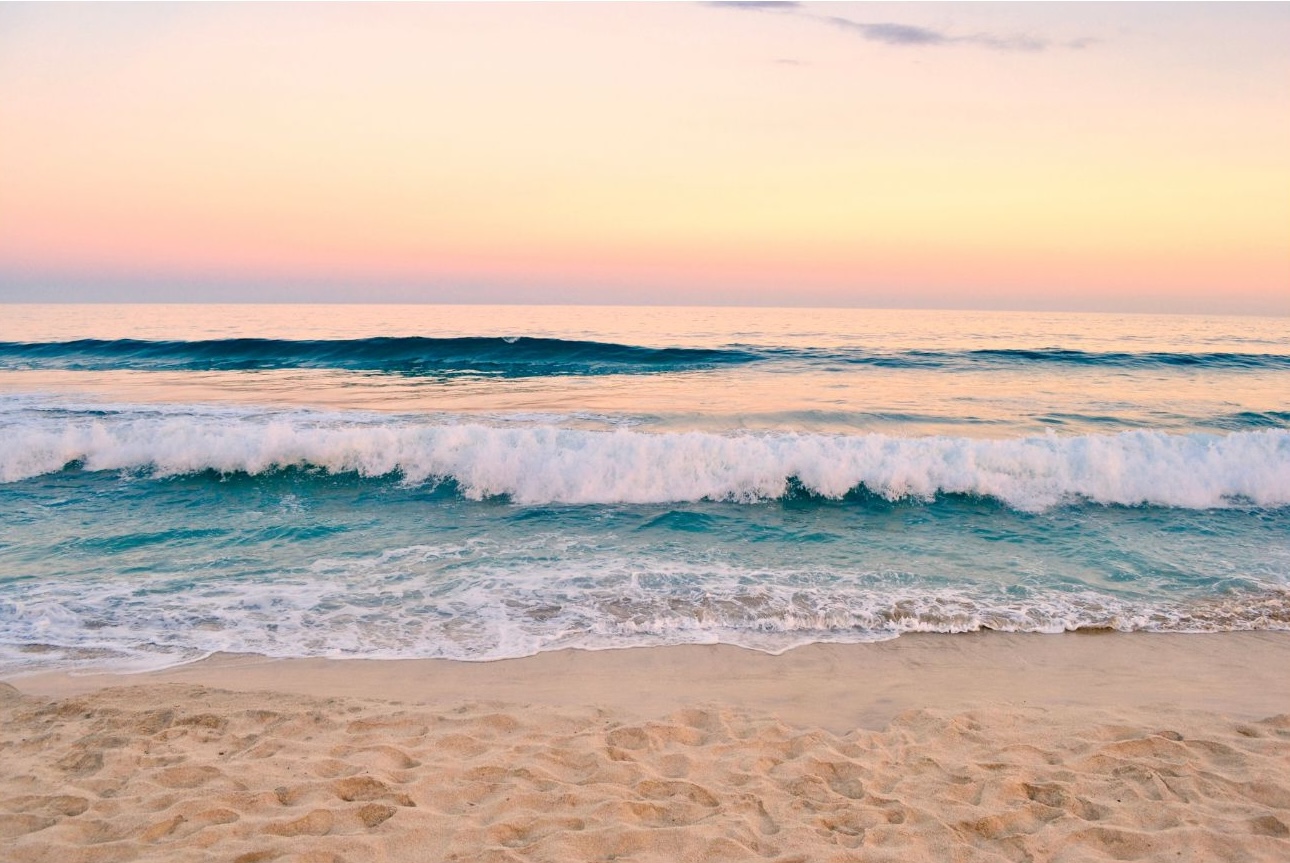 Calm ocean at sunrise, the hero image from the Therapy Journey website