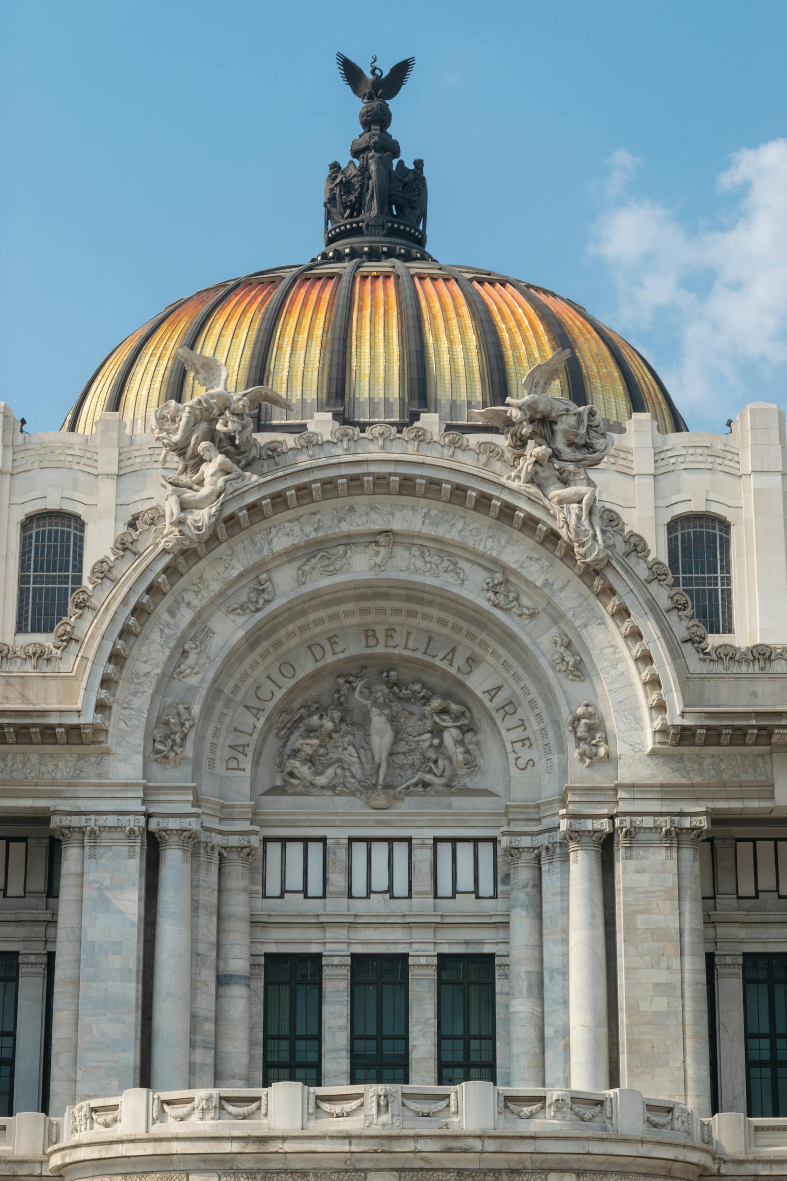 Close-up of the neoclassical dome and facade of Palacio de Bellas Artes in Mexico City, a cultural landmark. Photo by HECTOR ESLAVA on Pexels.