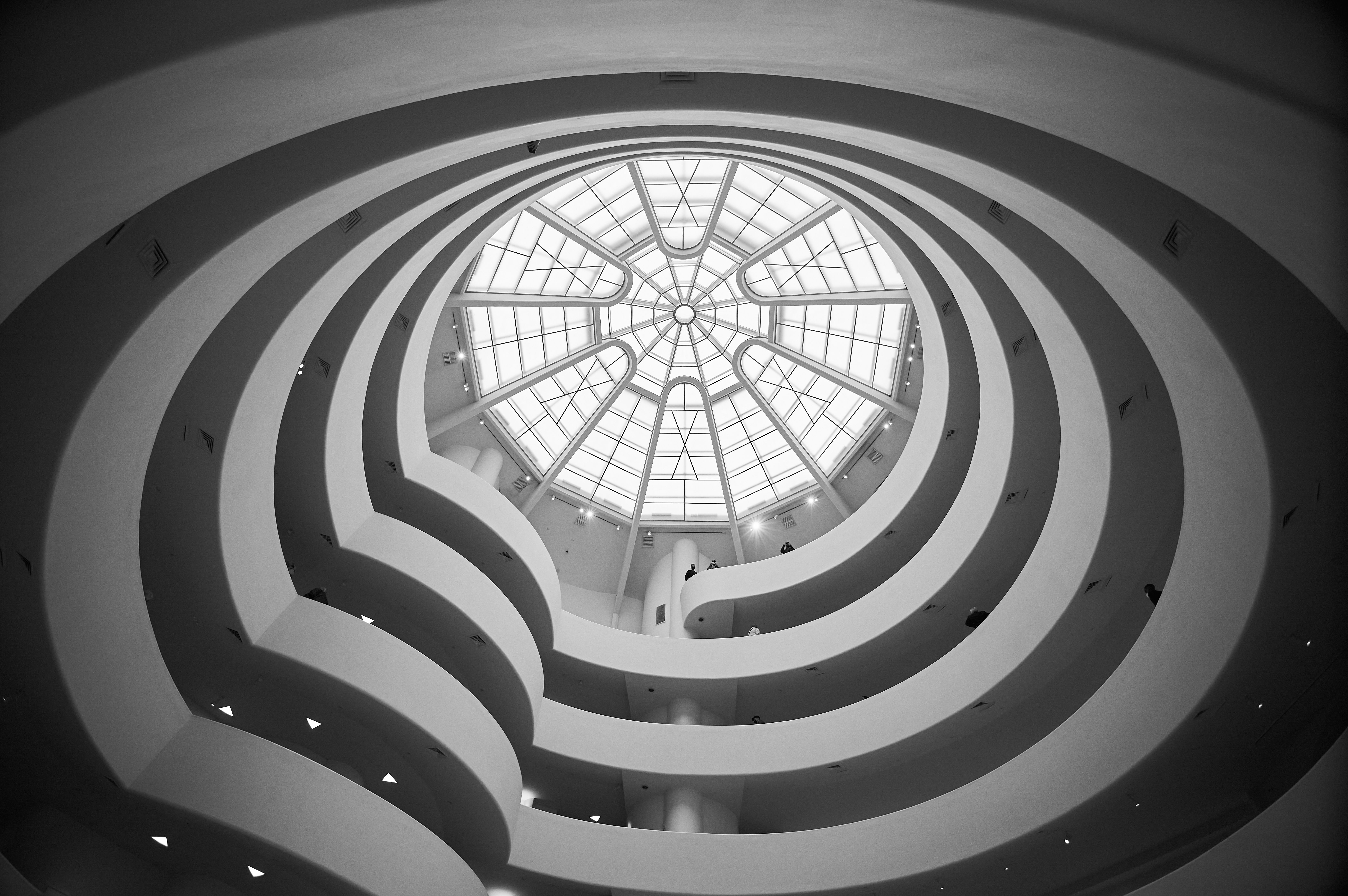 Looking up at the spiral rotunda and skylight inside the Guggenheim Museum in New York. Photo by Alexander Heiß on Pexels.