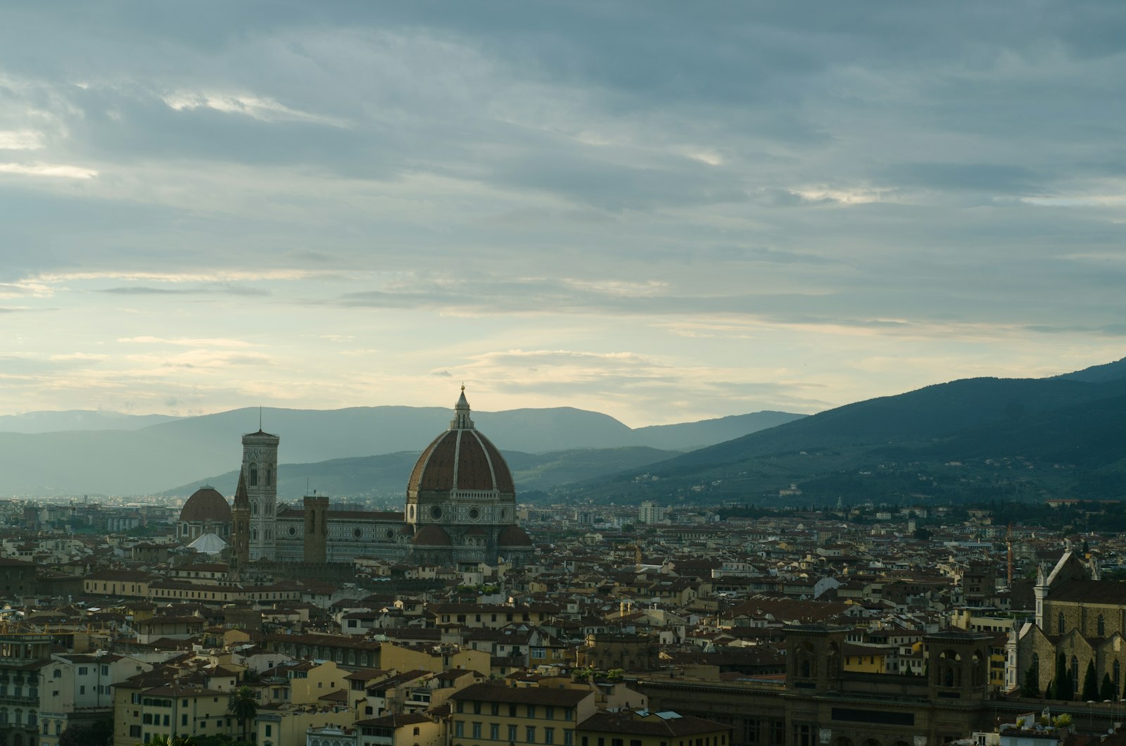 Dusk over Florence from Piazzale Michelangelo, the Duomo rising above the rooftops. Photo by Jacob Jolibois on Unsplash.