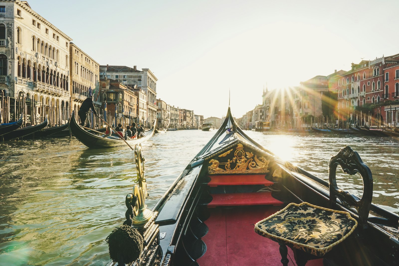 The view from a gondola's bow, low sun on the Grand Canal. Photo by Diego Gennaro on Unsplash.