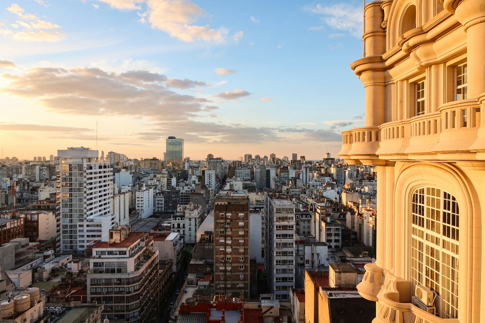 Rooftops of a Buenos Aires barrio glowing at sunset. Photo by Ash Coronado on Unsplash.