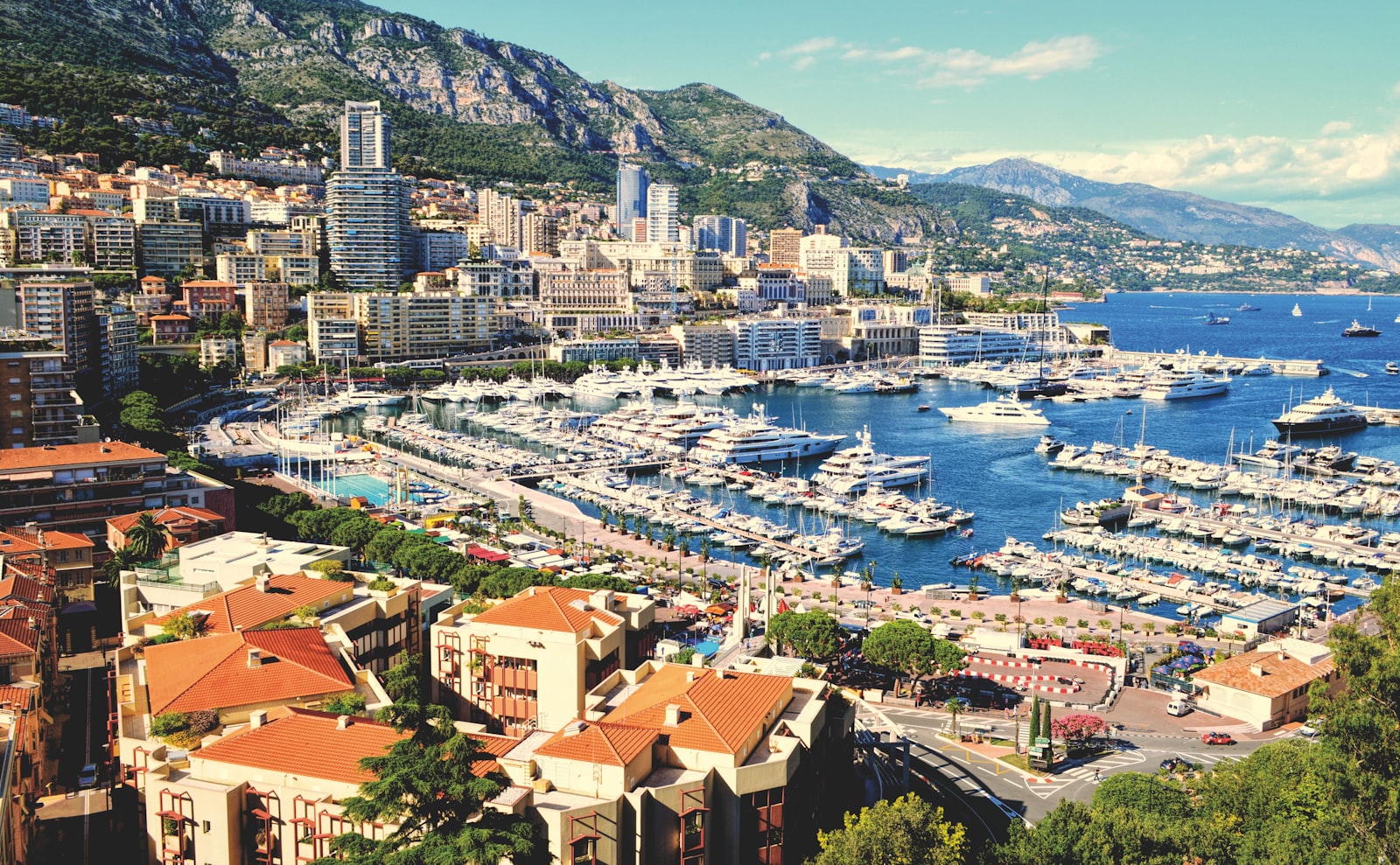 The harbour of Monaco packed with yachts below Monte-Carlo. Photo by Matthias Mullie on Unsplash.