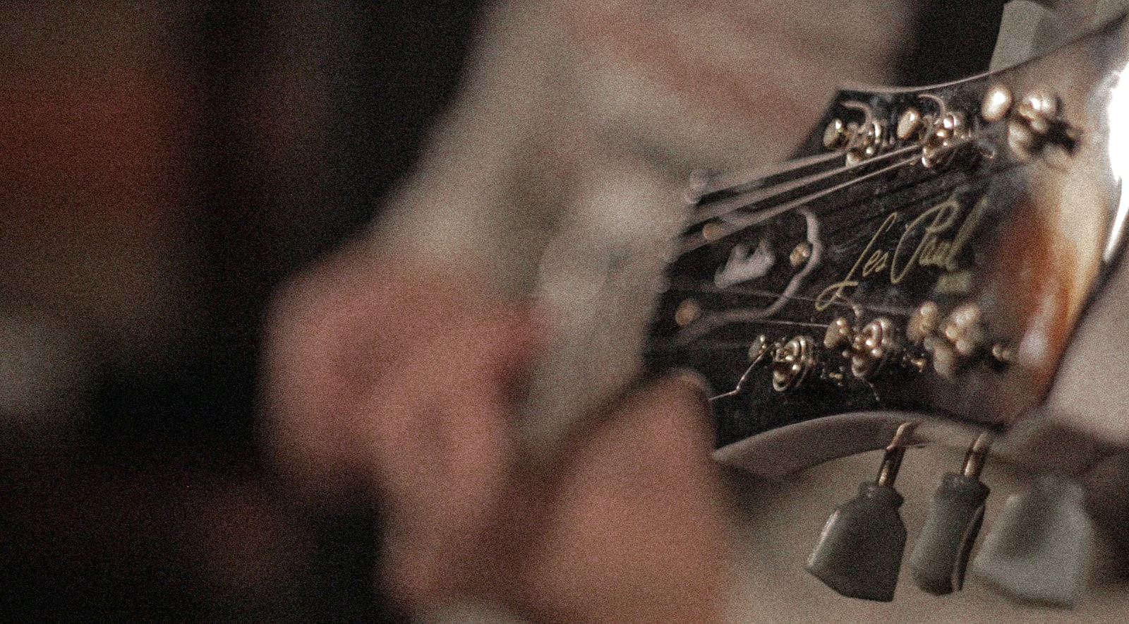 A close-up of a guitarist's hands on the strings. Photo by Alexandre Boto on Unsplash.