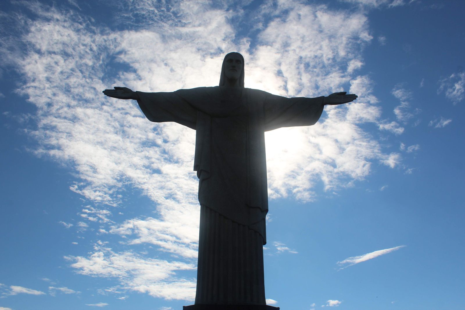 Christ the Redeemer with arms open against the sky. Photo by Eric Garcia on Pexels.