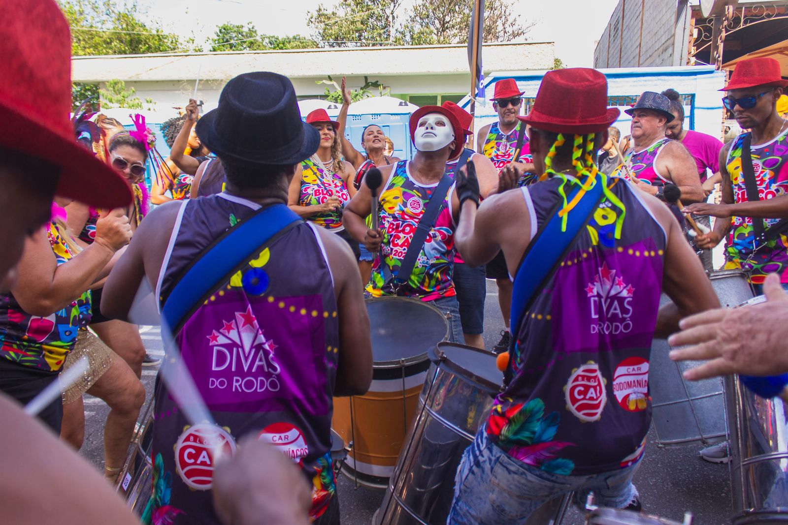 Drummers in a street samba bloco playing surdos together. Photo by Davi Nicoletto on Pexels.