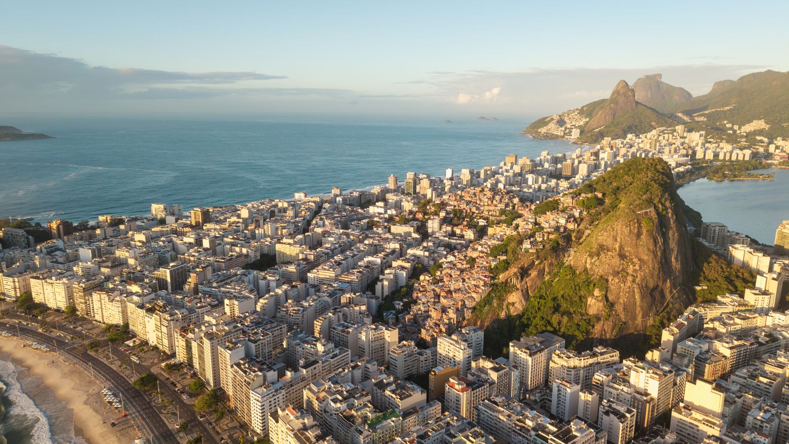 Rio's apartment blocks packed between the beach and the hills, seen from above. Photo by Filipe Braggio on Pexels.