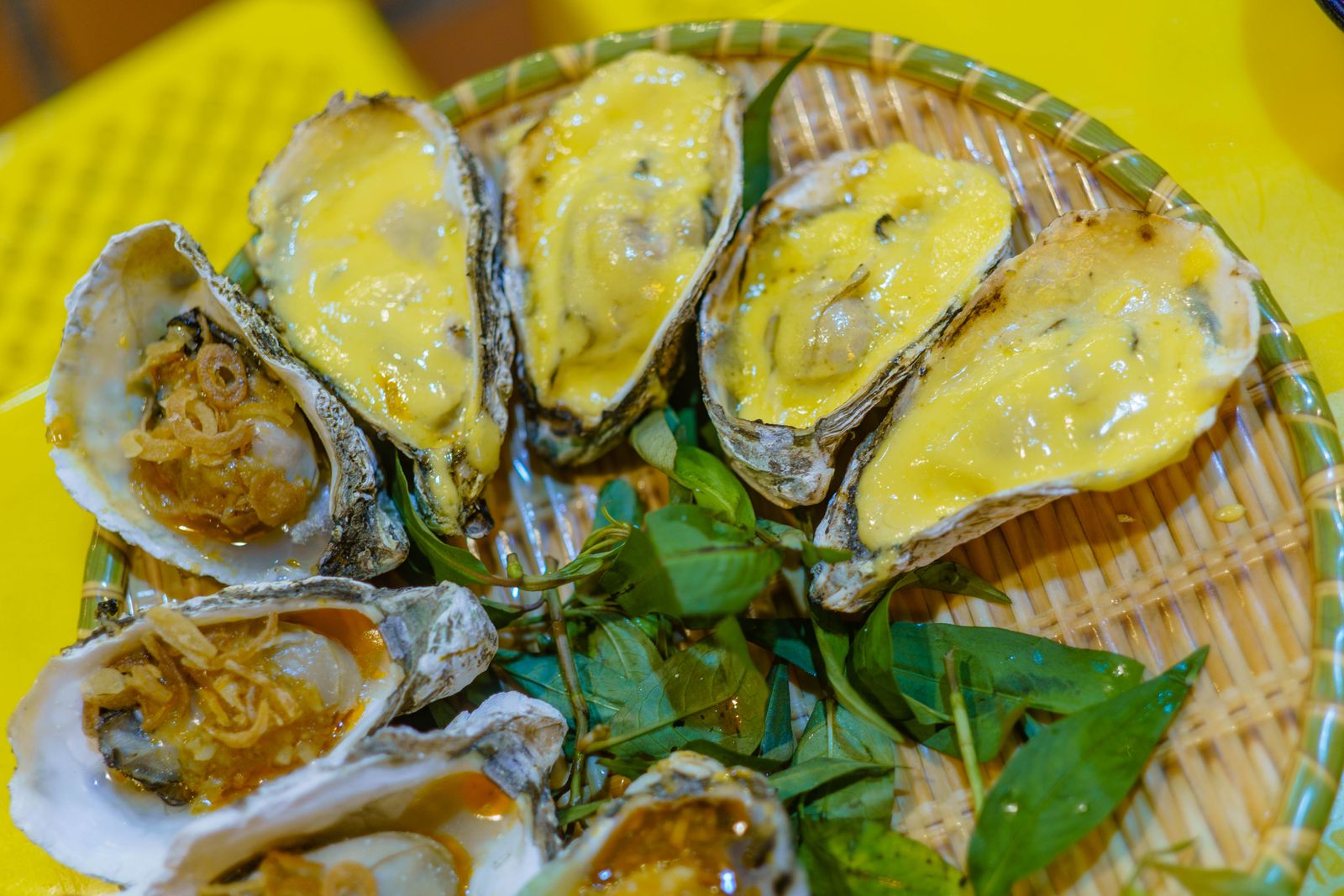 A tray of oysters grilled under melted cheese, the way the island serves them gratinadas. Photo by FOX on Pexels.