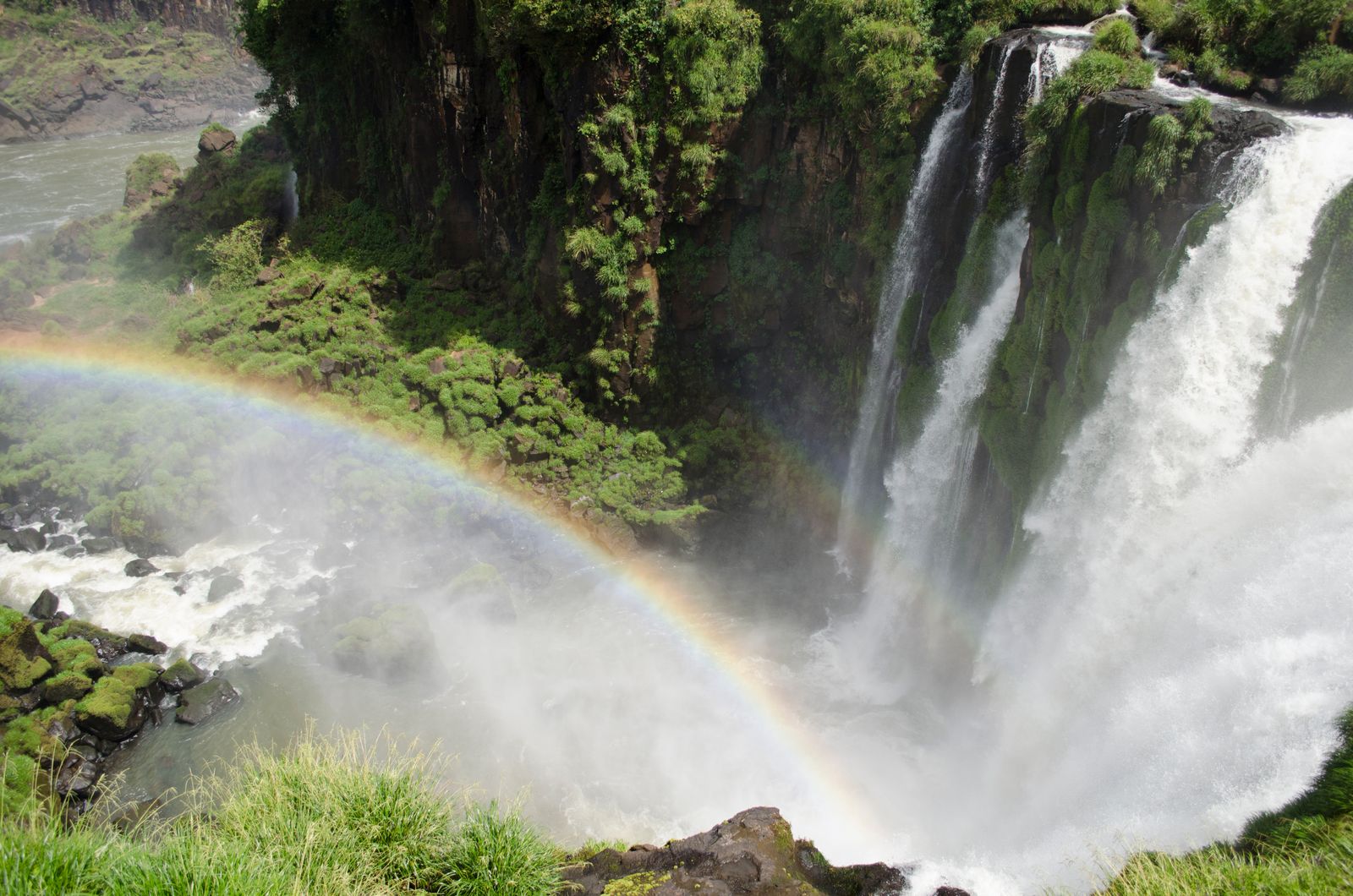 A rainbow standing in the mist below the falls at Iguazú. Photo by Pamela Licropani on Pexels.