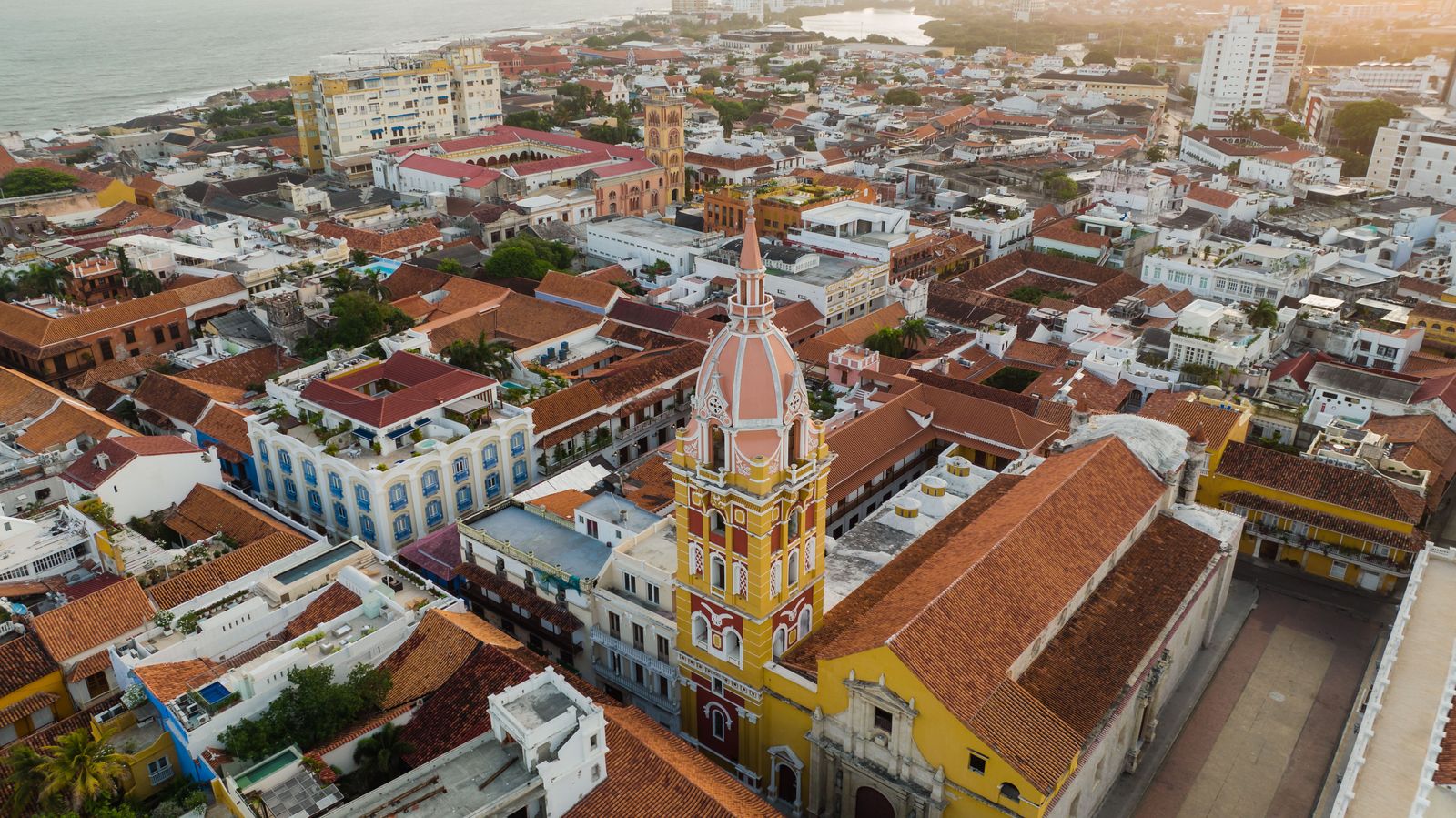 Cartagena's walled city from the air, with the cathedral tower above the rooftops. Photo by K on Pexels.