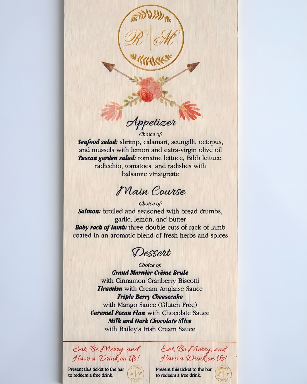 Laser-cut wooden wedding menu card featuring a "R|M" monogram crest with floral arrows, listing appetizer, main course, and dessert options, with two drink tickets at the bottom.
