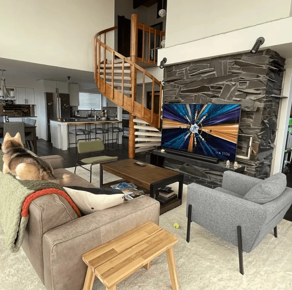 family room with beautiful spiral staircase, custom remodel