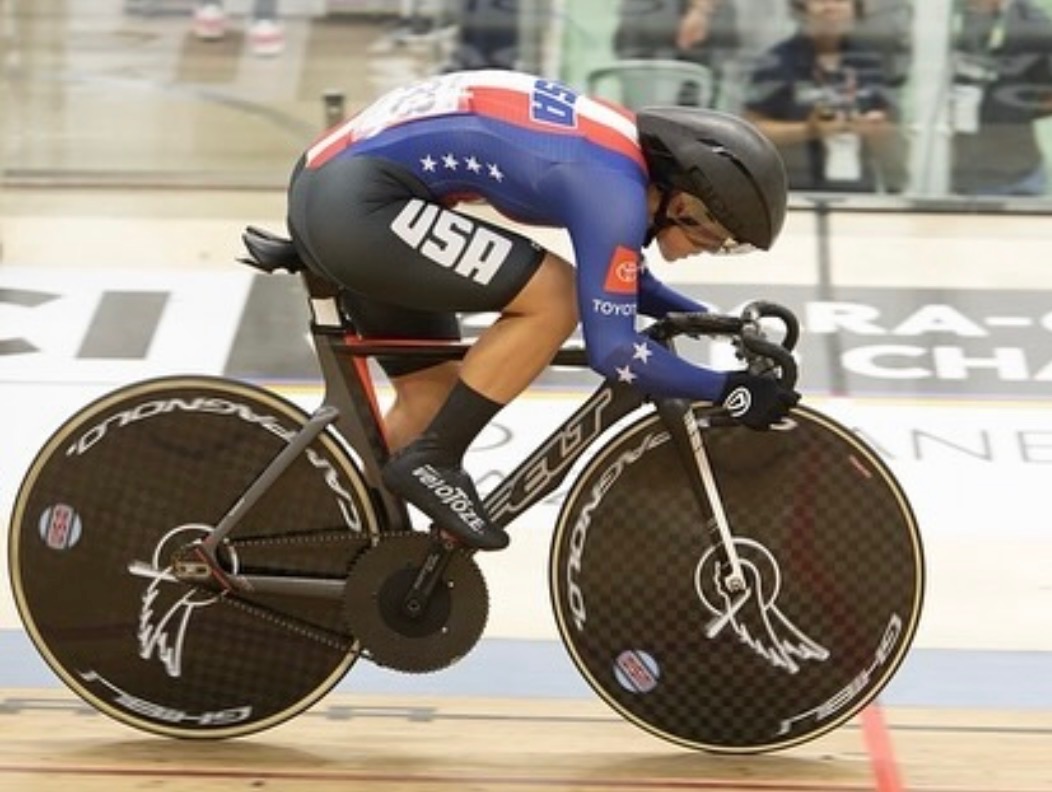Katie Walker competing as a para track cyclist in Team USA kit.