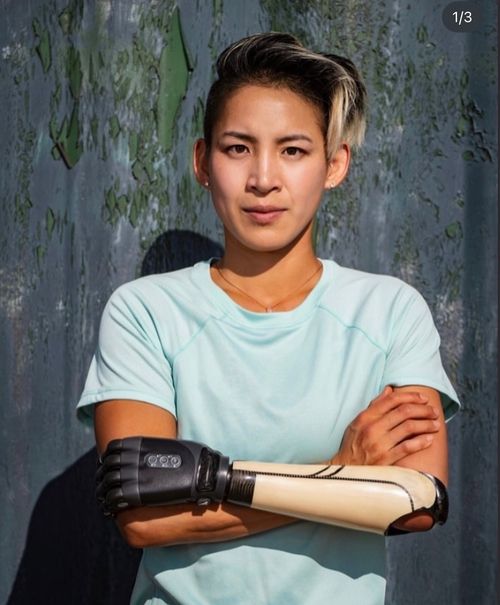 Katie Walker, elite para track cyclist, standing with confidence and focus.