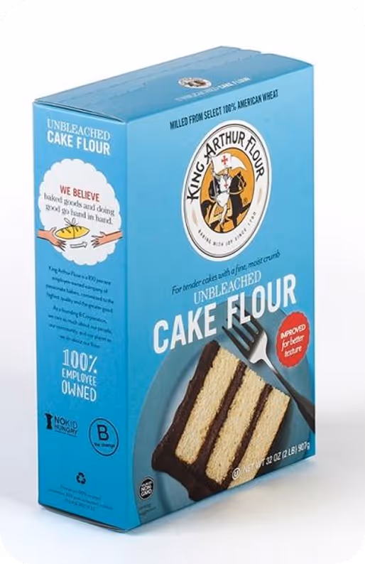 Blue King Arthur unbleached cake flour box with layered chocolate cake image on front.