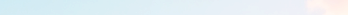 Soft, blurred horizon with a subtle orange and blue sky at sunrise or sunset.