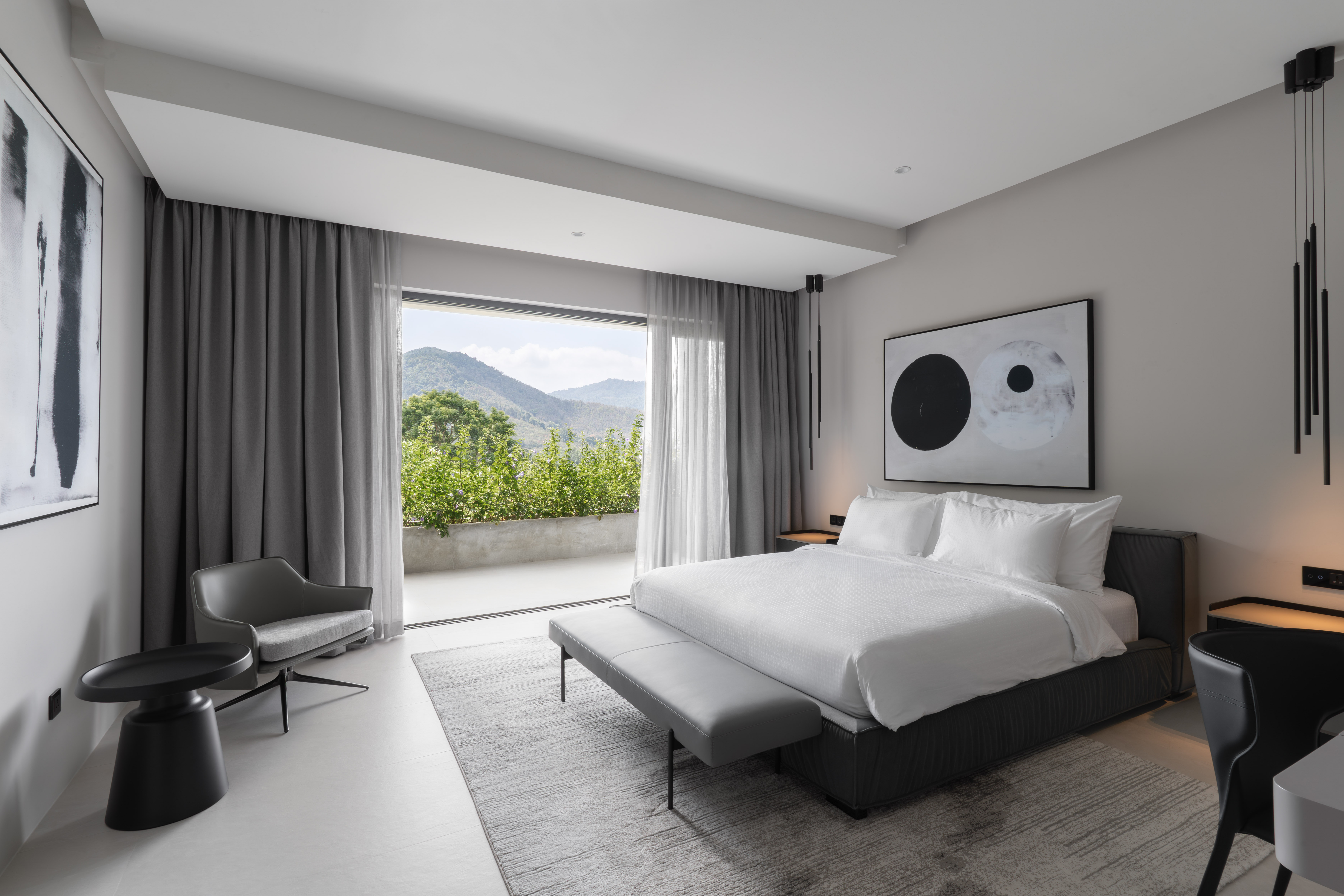 Mountain-view guest bedroom at Villa 6