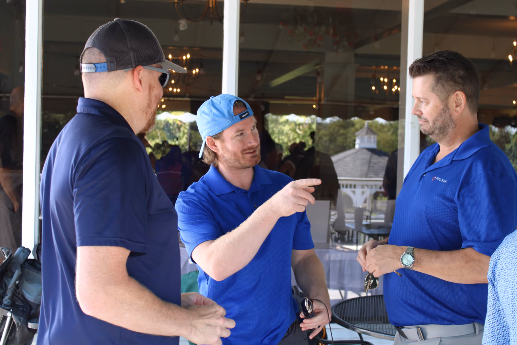 Kelser Corporation IT professionals networking and discussing managed services at a corporate golf event in Connecticut