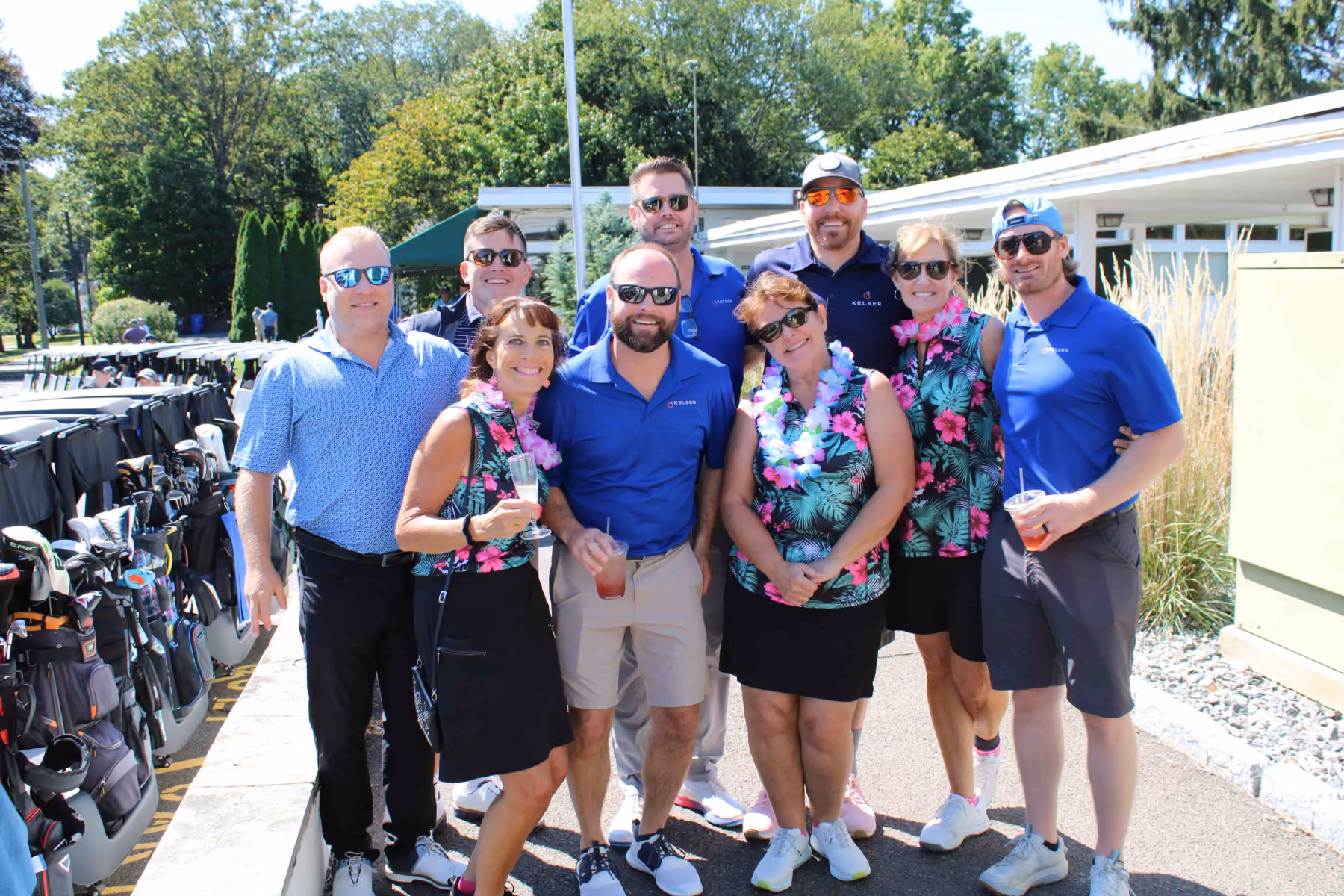 Kelser Corporation IT team members posing together at outdoor golf charity event in Connecticut