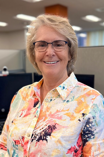 Kelser Corporation IT support team member smiling in modern office workspace