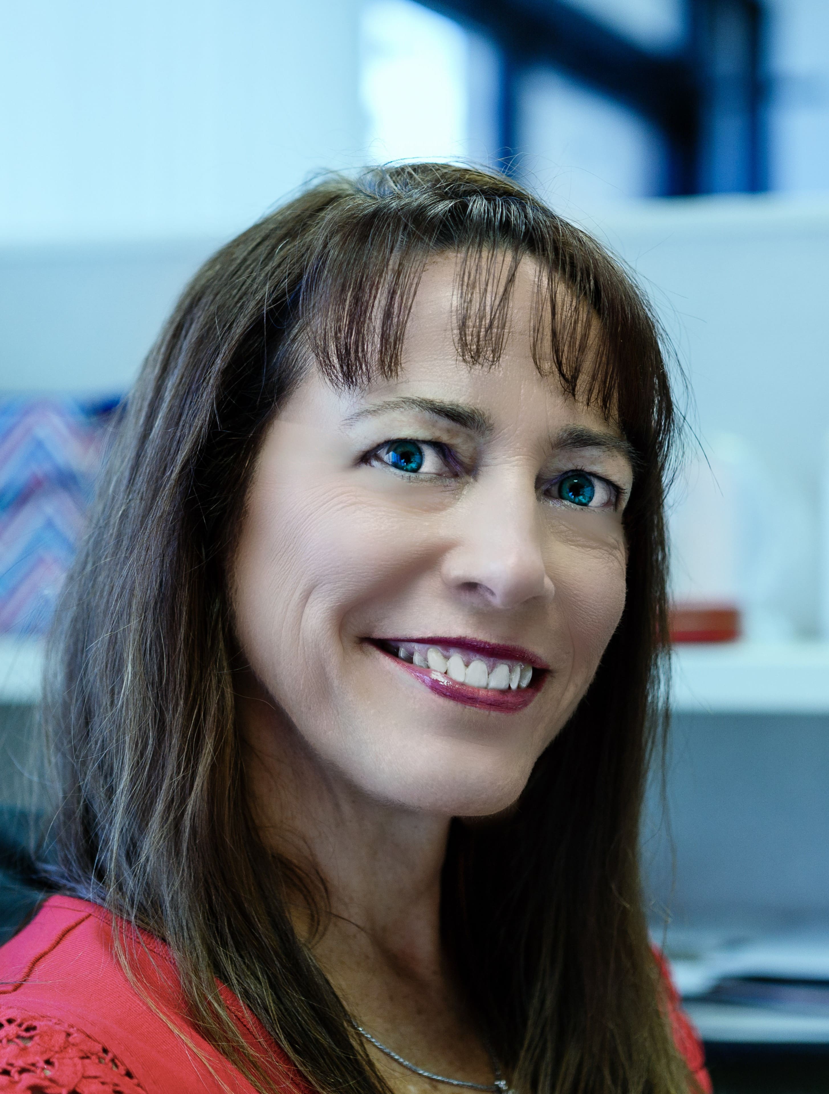 Kelser Corporation IT support team member smiling in modern office environment