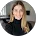Smiling professional woman in business casual attire, ideal for IT managed services team profile photo