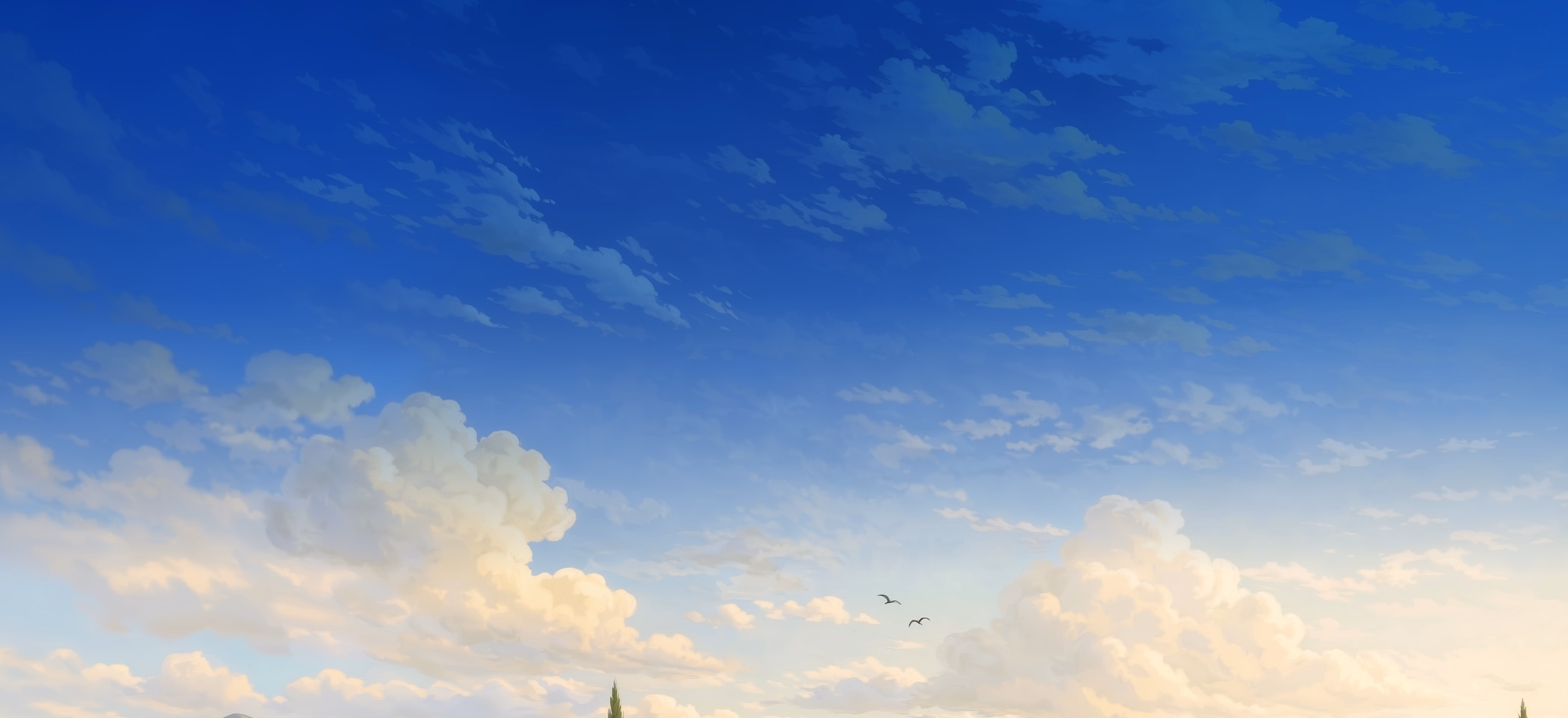 Blue sky with white fluffy clouds and distant church spires on the horizon