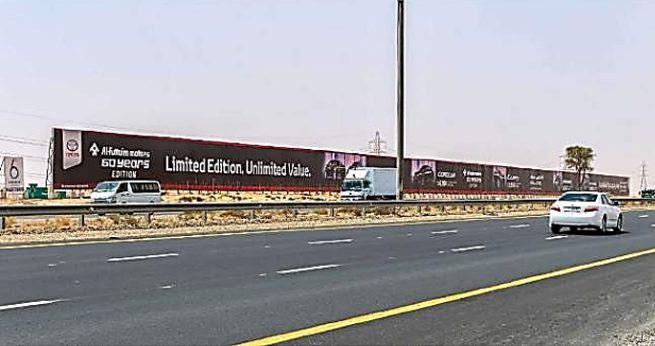 Long roadside hoarding advertising in Dubai