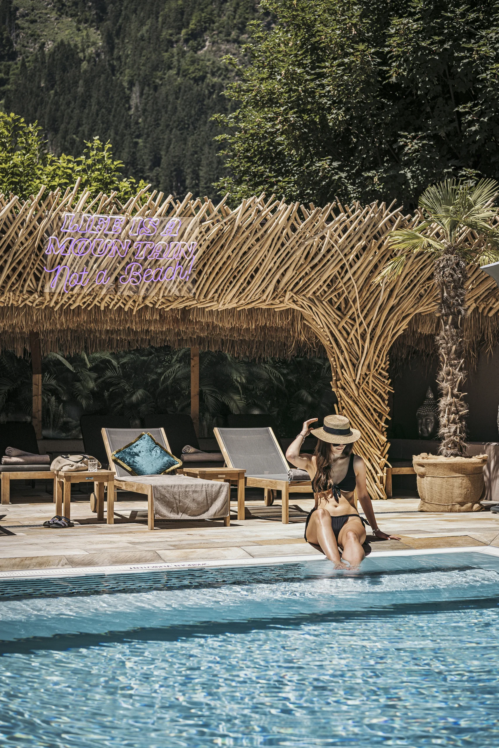 Zillertalerhof Alpin Hideaway design hotel hero image with pool and mountain setting in Mayrhofen.
