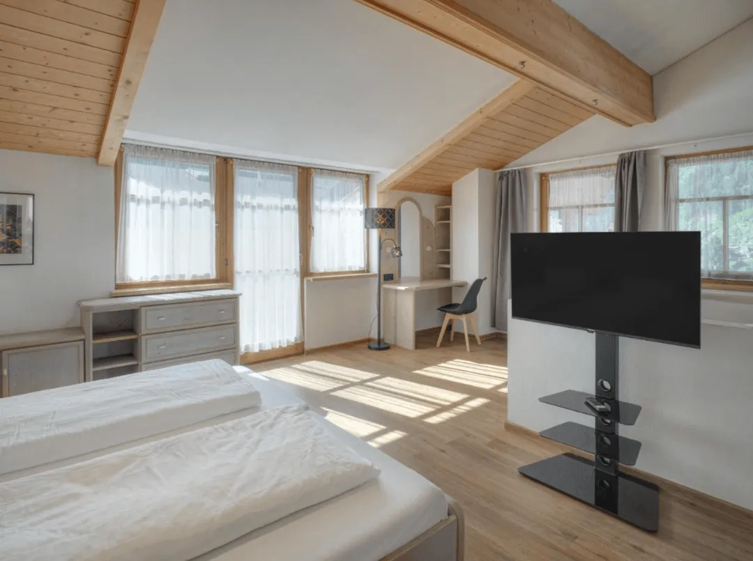 Edge of Town apartment bedroom near Mayrhofen for Snowbombing stays.