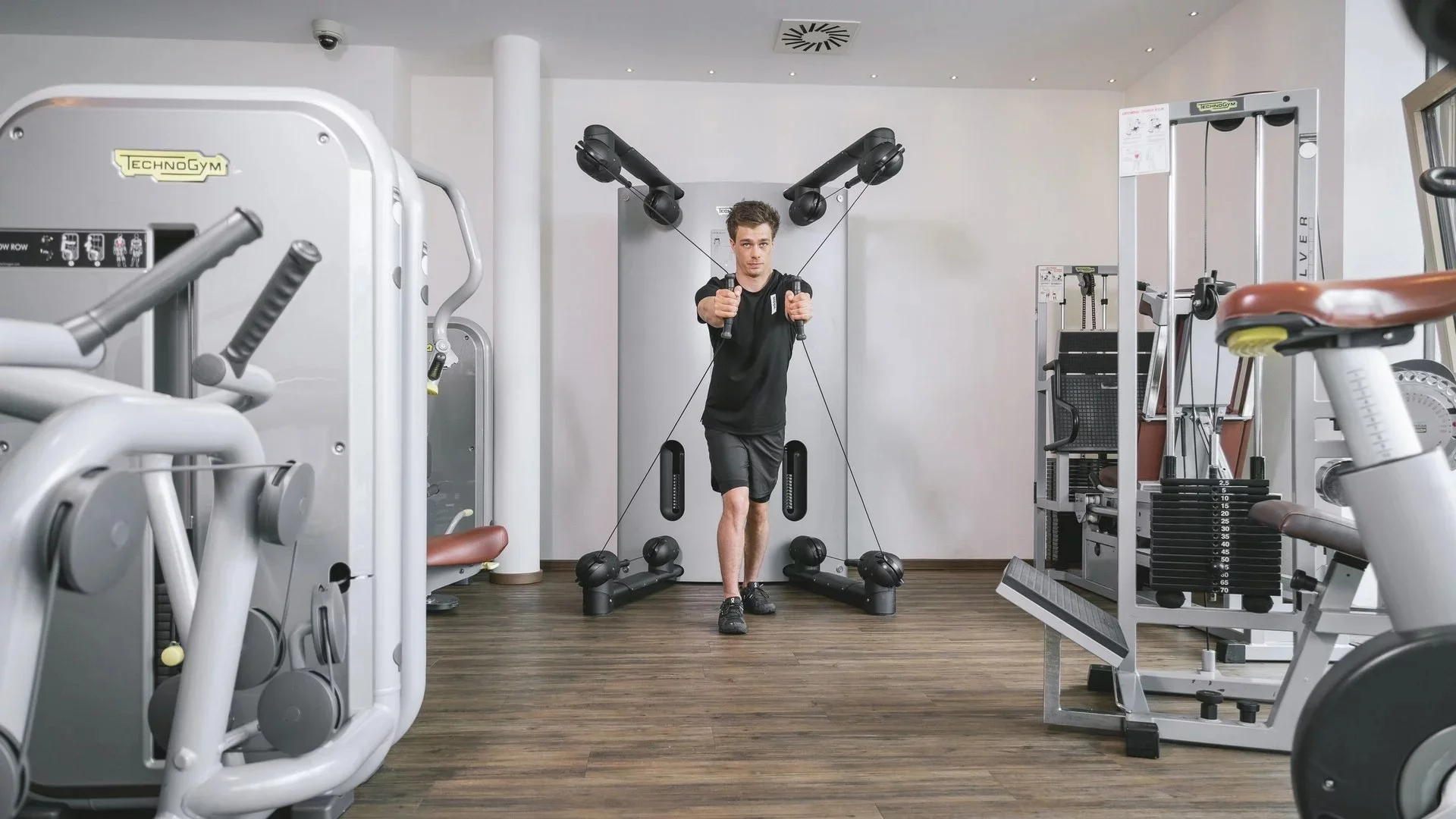 Hotel Strass man exercising in the Technogym gym at the Mayrhofen four-star hotel.