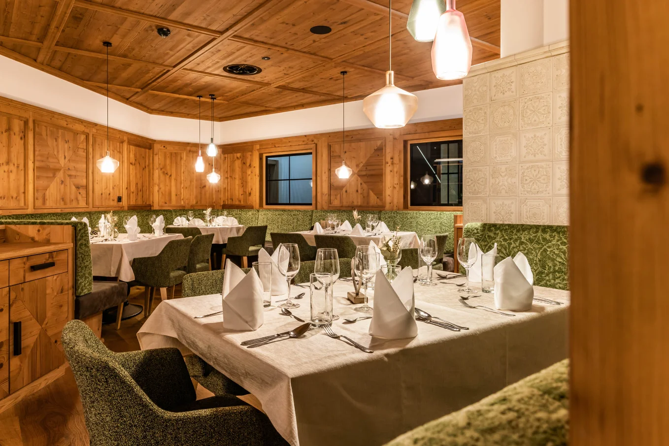 Berghof wooden-ceiling dining room and restaurant at the Mayrhofen four-star hotel.