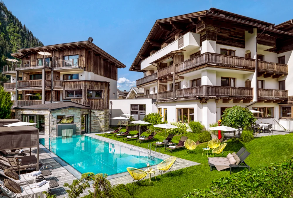 Huber's Boutique alpine luxury resort pool area at the Michelin Guide Mayrhofen hotel.