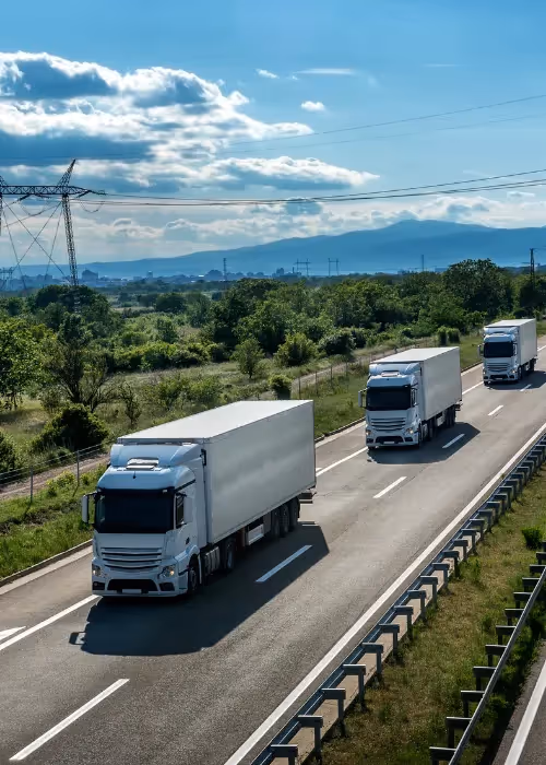 Trucks driving down road