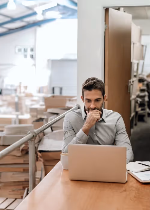 Warehouse worker using computer