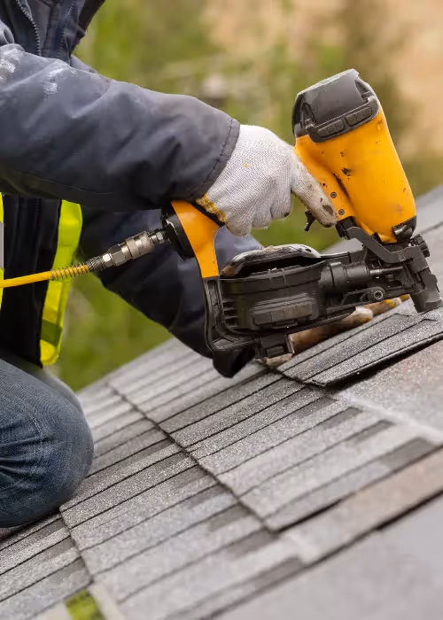 Roofer fixing a roof