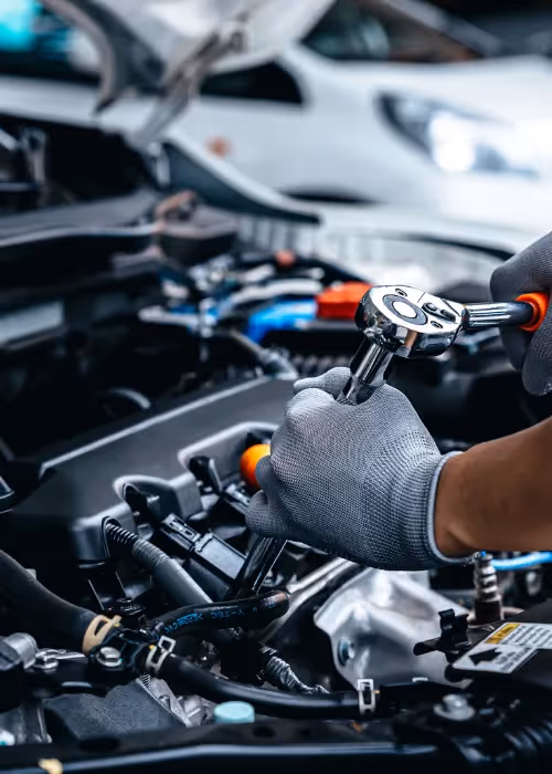 Mechanic working on a car engine