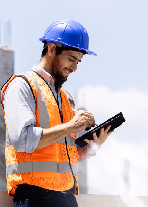 construction manager using software on tablet