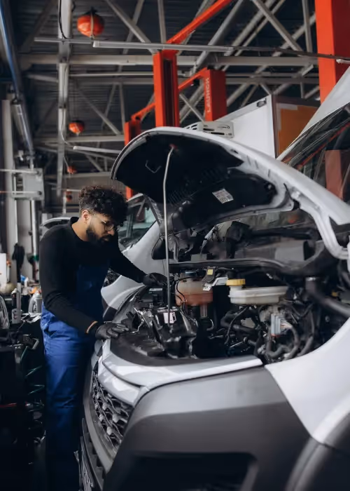 Person doing essential maintenance on van