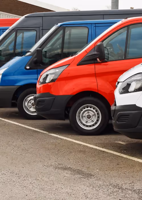 different colour vans in row